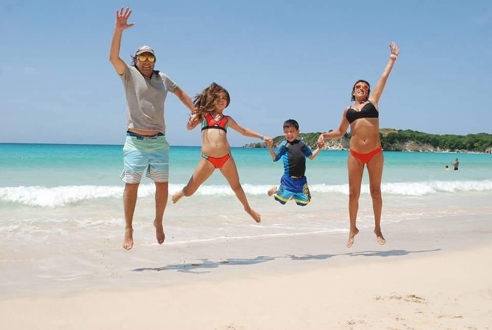 A family on the beach at the end of the day